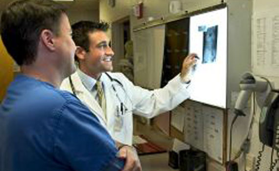 Physicians reviewing x-ray